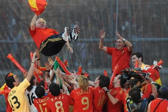 Spain's players toss coach Luis Aragonés into the air after their triumph at Euro 2008