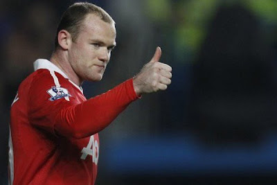 Wayne Rooney give the tumbs up as his team plays