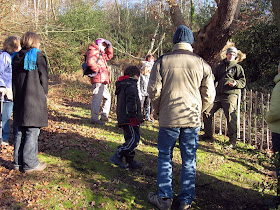 Ranger Luke Barley (right) talking to a group while standing by a veteran oak on West Wickham Common