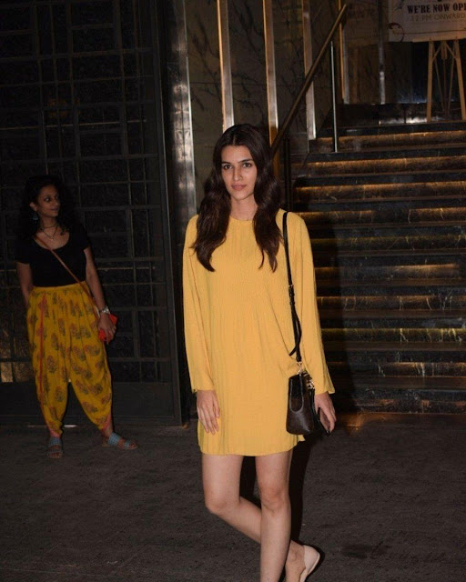 Kriti Sanon posing gracefully in a chic outfit
