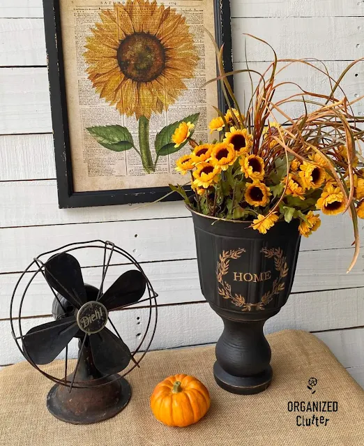 Photo of a black DIY urn with fall decor
