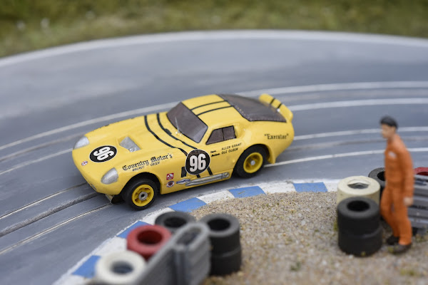  Yellow Shelby Cobra Daytona zooming past the spectators