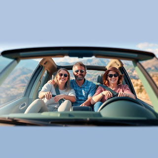 Family in a car wearing seatbelts while driving safely in Canada.