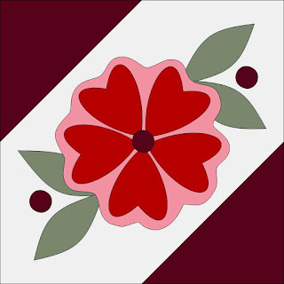 pink red and maroon rose on a quilt block