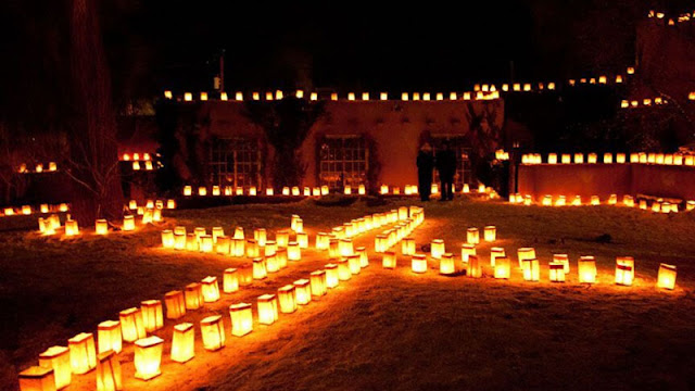 Farolitos arranged in the snow