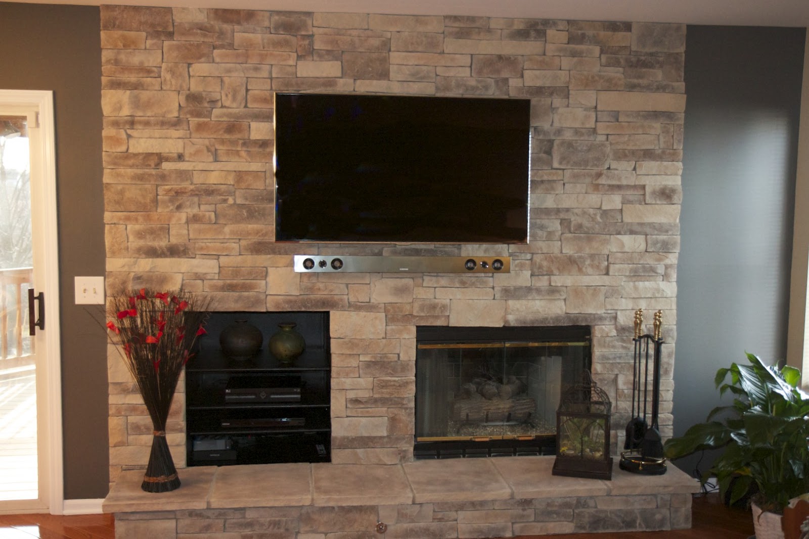 Stone Wall Living Room with Fireplace