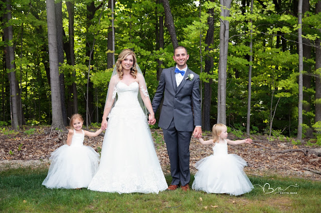 bride and groom with flower girls at Noah's Event Venue in Auburn Hills Michigan