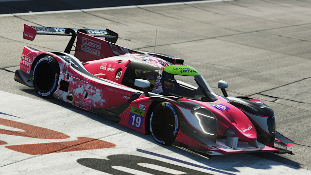 Picture from rFactor 2: a Ligier JSP320 in the Queens' Design colours. It is pink with black matte and glossy white accents. On the sides there is Victoire Laviolette, the team's mascot.