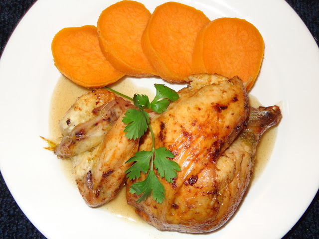PORTIONS: 4 INGREDIENTS 4 lb. whole chicken 2 cups water or chicken broth 1 cup white wine ½ cube chicken bouillon, without monosodium glutamate 2 tsp. cornstarch CHIMICHURRI PASTE SEASONING 1/4 cup chopped onions 3 garlic cloves, chopped 2 tbsp. chopped parsley ½ tsp. dried oregano leaves or 1 tsp. fresh 1½ tsp. salt ½ tsp paprika ¼ tsp ground black pepper ½ tbsp. soften butter 2 tbsp. olive oil METHOD Make the chimichurri paste placing all the ingredients in a blender. Lately it is recommended not to wash the chicken, for the risk of contamination when the water splashes on other surfaces. I’m sorry, but I rinse the chicken inside and out, with cold water. Pat dry the chicken with paper towels and place it in a dish temporarily. Then clean with soap and water the entire area of the sink or surfaces that may have been contaminated. With your fingers, separate the skin from the breast and thighs without tearing it apart. Using a teaspoon spread the ½ the chimichurri underneath the skin, around the breast and thighs. Spread the rest of the chimichurri over the chicken skin. Bend the wings under the chicken and tight the chicken legs with a kitchen twine. Pour the water and wine in a pot. Bring it to a boil and dissolve the chicken bouillon. Place the liquid in a roasting pan and put a griddle on top. Place the chicken on top of the griddle. Preheat the oven at 325°F / 163°C Roast the chicken for about 90 minutes. Baste the chicken every 20 minutes. The chicken should have a minimal internal temperature of 165°F / 74°C or if you pierce it with a skewer the juices should run clear, cook until golden brown. Pour the juices in a fat separator discard as much fat as possible. Pour the liquid in a pot and bring it to a boil. Mix the cornstarch with 1 tbsp. of water and mix it into the liquid. Let the sauce cook for 3 minutes.  Untie the legs, carve the chicken and serve with the sauce.