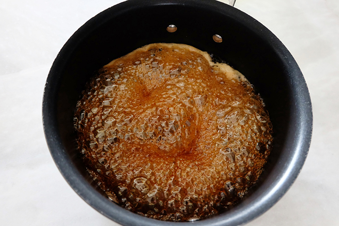 caramelized honey in saucepan bubbling