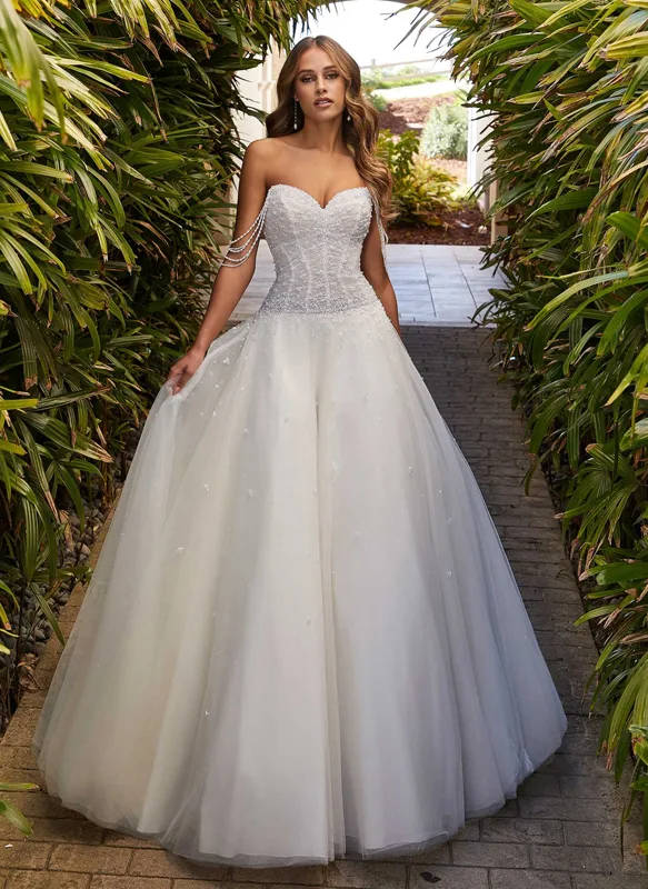 beautiful bride in a posh ball wedding gown embellished with crystals