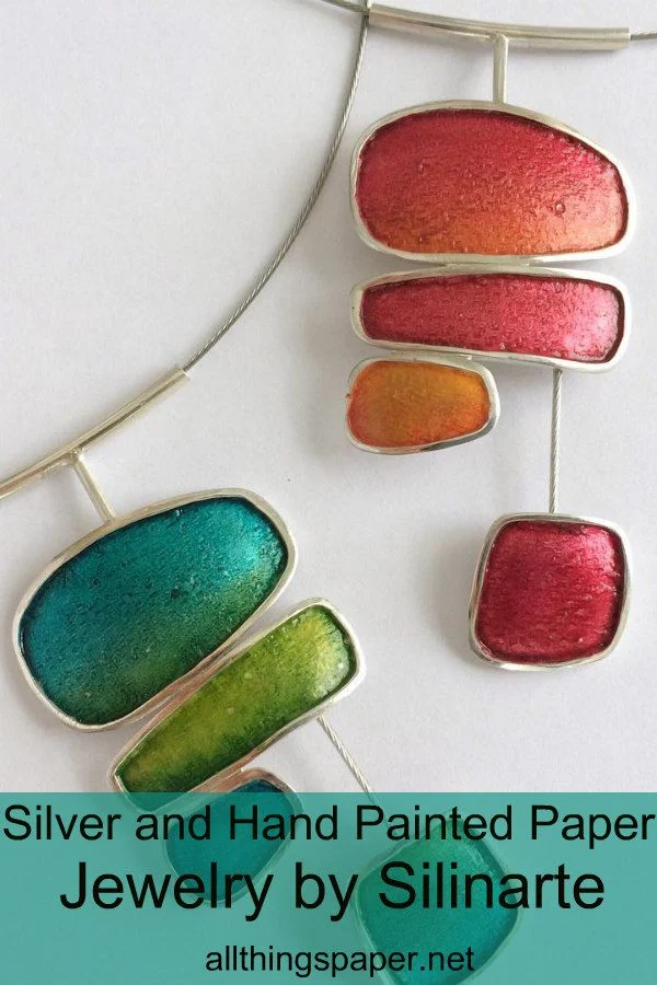 silver and hand painted paper necklaces in green, blue, pink, and coral