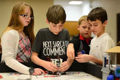 Four students are working a project