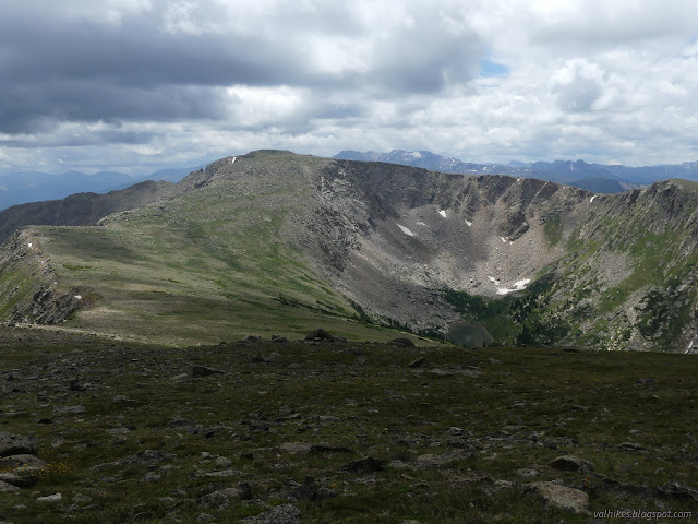 19: wide peak and lake below