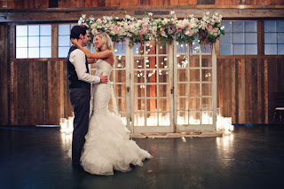 Megan and Tyler standing before their wedding ceremony triptych.