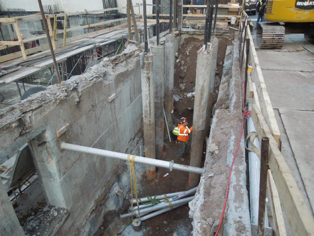 Picture of the worker checking concrete wall 