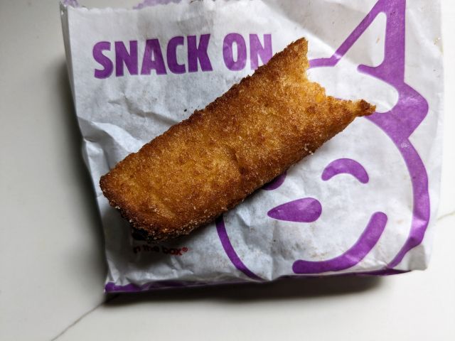 The bare side of a Jack in the Box Churro French Toast Stick.