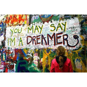 A photo of street grafitti that says, You may say I'm a dreamer, from the song Imagine by John Lennon