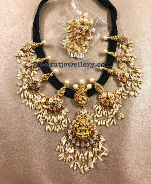 Black thread necklace amongst antique operate Lakshmi pendants as well as nakshi operate peacock motifs howdy Guttapusalu Sets amongst Lakshmi Motifs