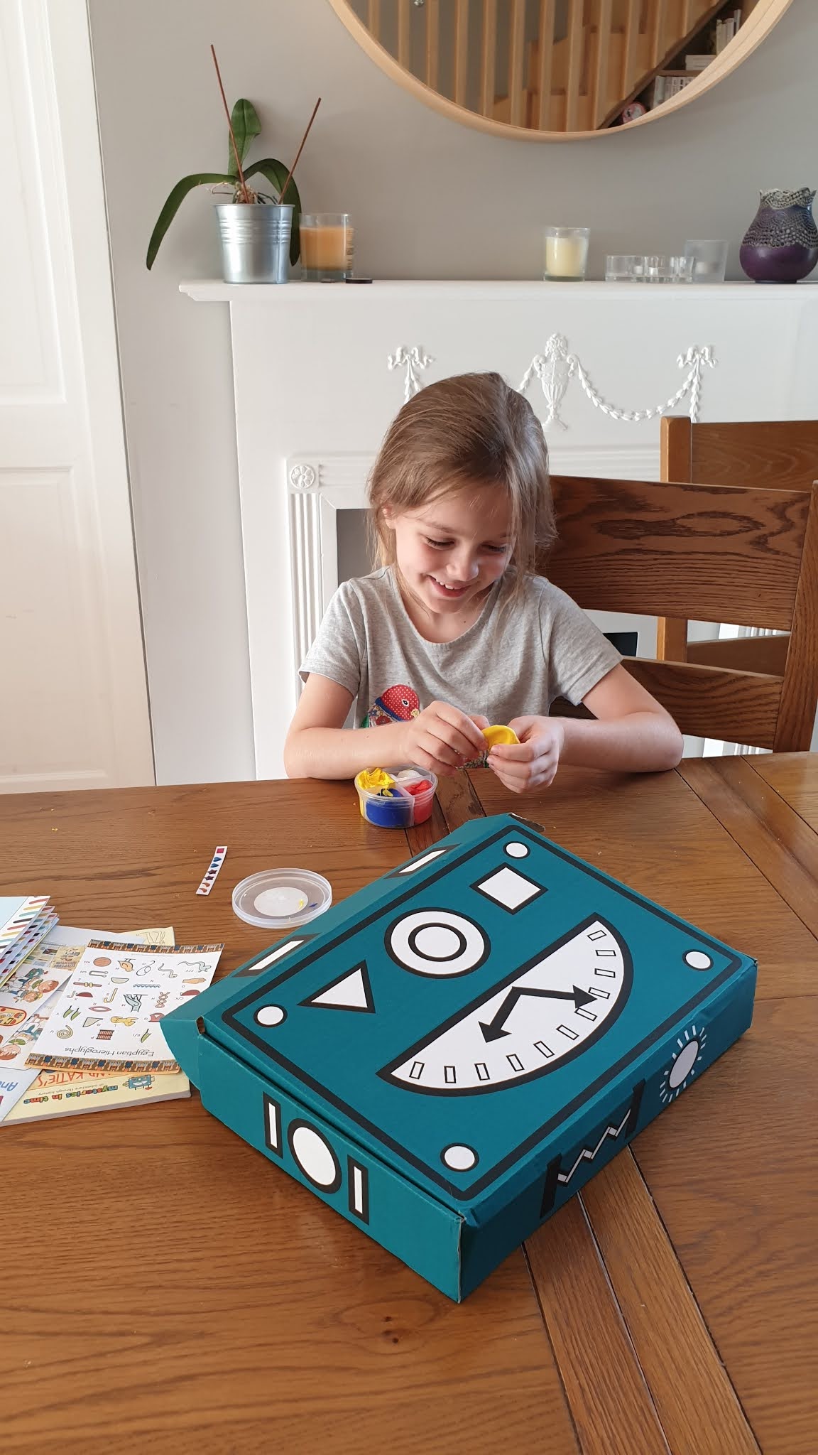 girl playing with a box