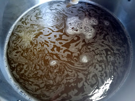 The wort coming to a boil