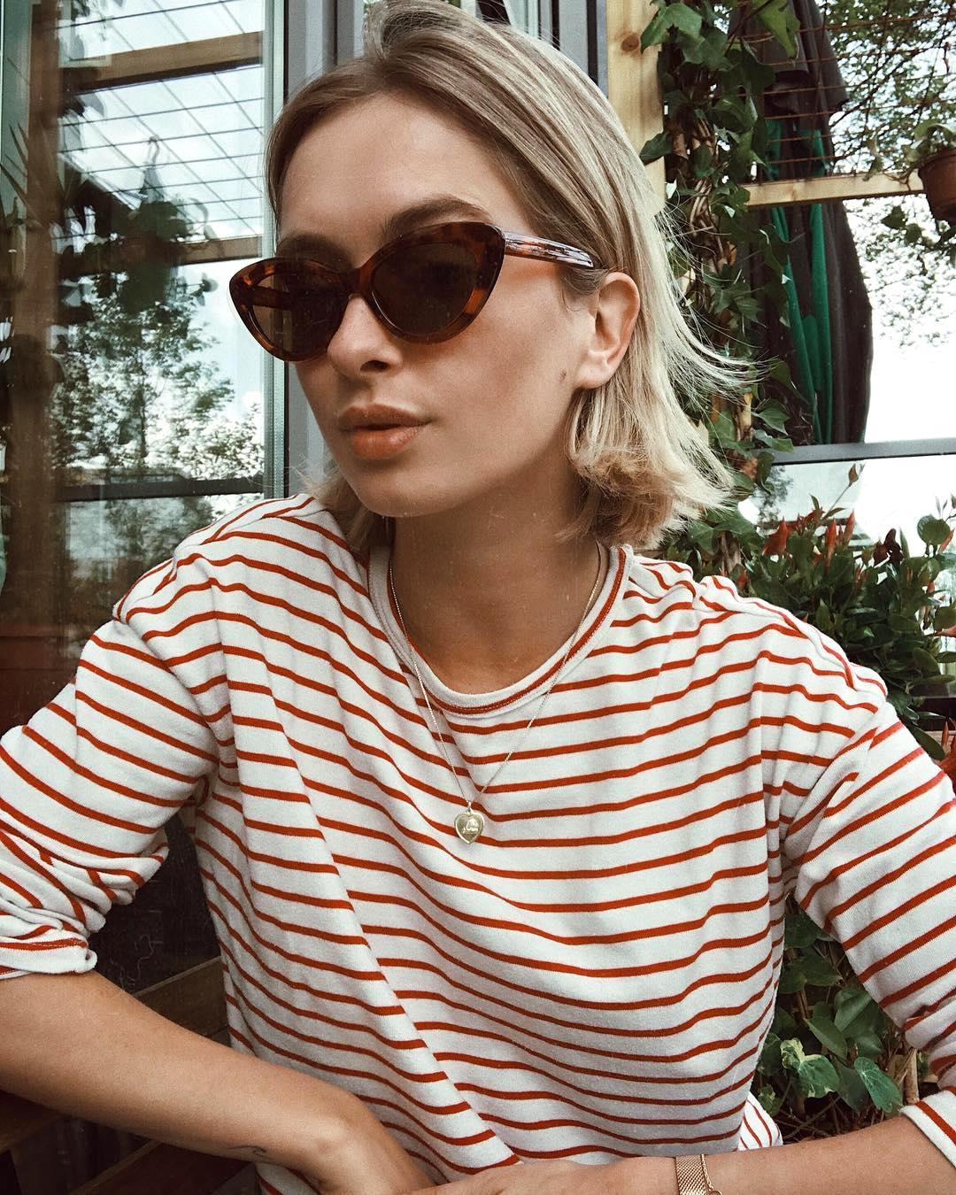 25 Cool Striped Long-Sleeve T-Shirts to Shop Now — Rianne Meijer In Cat-Eye Sunglasses and a Red Striped Tee