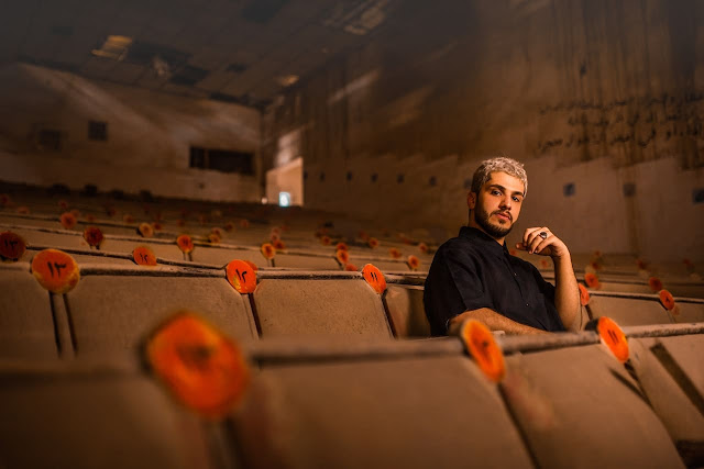 person watching movie in cinema theatre