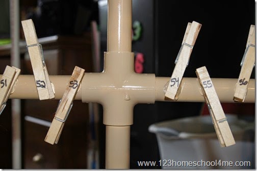 Clothespin branches are hot glued onto the PVC tree Clothespin branches are hot glued onto the PVC tree