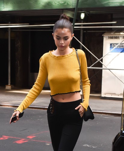 Selena Gomez ? Braless wearing a yellow sweater out in NYC