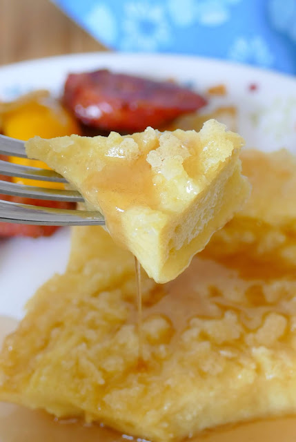 This simple to make and unique breakfast recipe uses basic fridge and pantry staples like flour, eggs, butter and milk and is super tasty! Top it with maple syrup, powdered sugar or fresh fruit to make it sweet! Serve with your breakfast favorites for a complete meal that will feed the whole family!