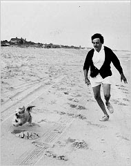 Kurt Vonnegut on the beach in East Hampton, N.Y., with his Lhasa apso, Pumpkin, on July 19, 1976. Photograph by his wife, Jill Krementz.