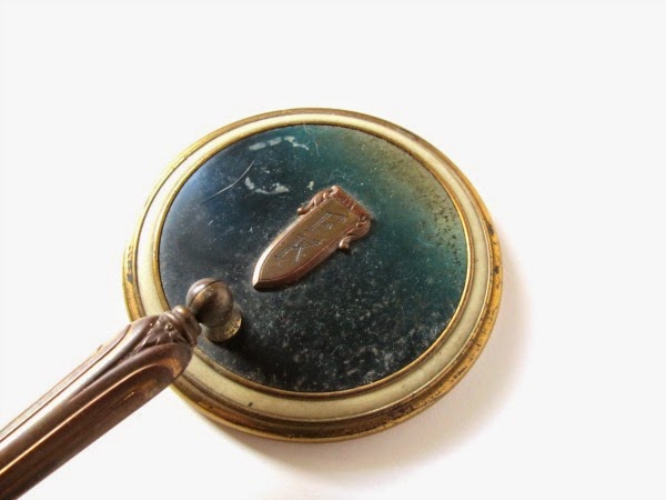 https://www.etsy.com/listing/188766644/vintage-hand-mirror-with-adjustable?ref=shop_home_active_2