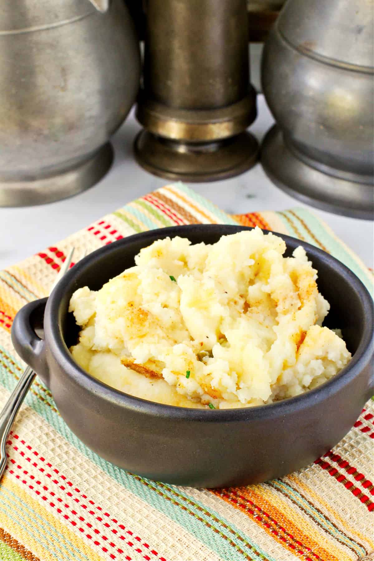 Make Ahead Mashed Potatoes in a small black bowl.