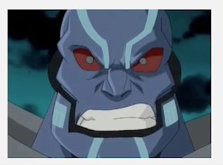 Apocalypse with a furious look on his face. His skin is blue with light blue highlights through it. His eyes are bright red.