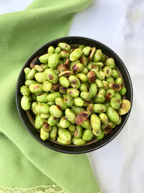 Finished bowl of roasted shelled edamame with sea salt.