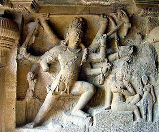 Shiva impaling Andhaka; Stone temple carving Ellora.