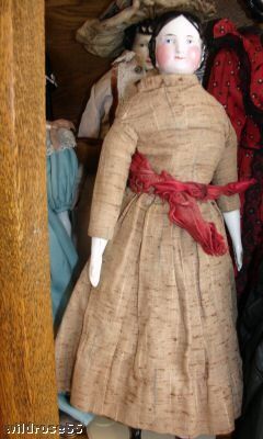 Antique china doll covered wagon hairstyle 1850s