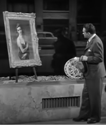 Richard Wanley (Edward G. Robinson) awestruck by the woman in the window