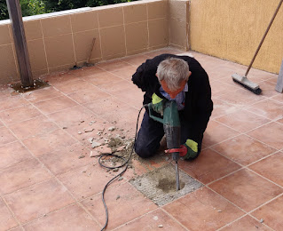 Sally drilling a new hole