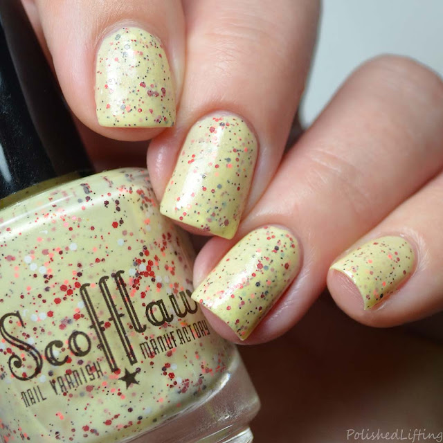 yellow crelly nail polish with red glitter