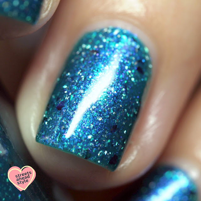 Tropical blue nail polish with holo flakes and multicolored flakes