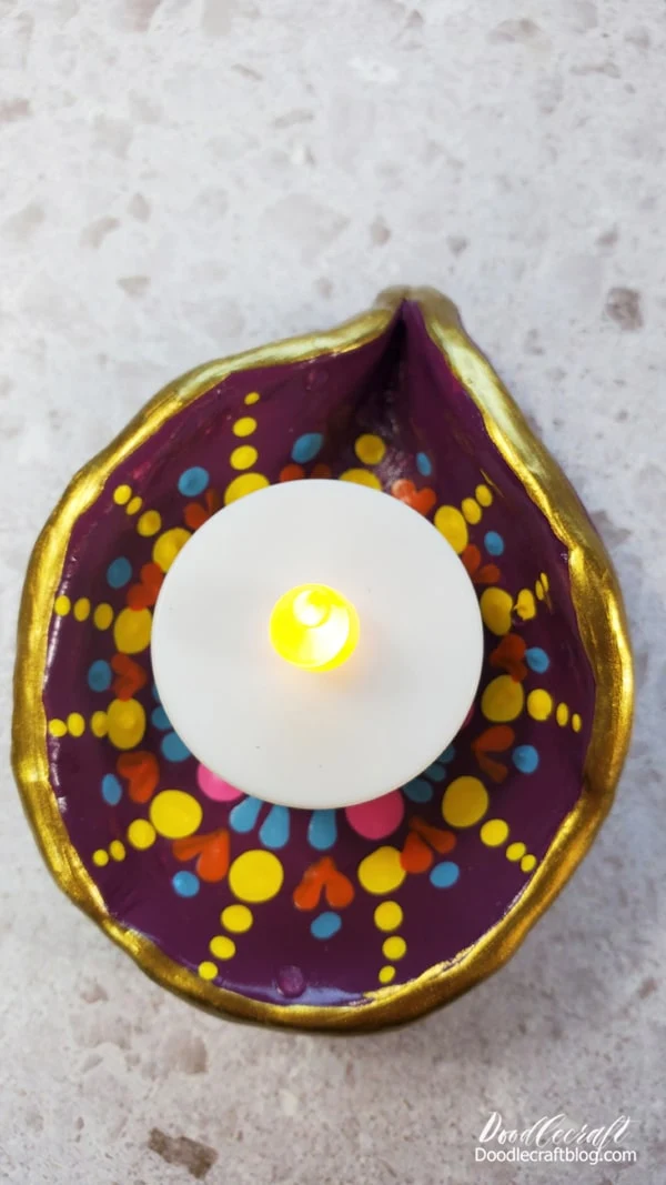 Light up the whole house with brightly colored diyas and battery lights.
