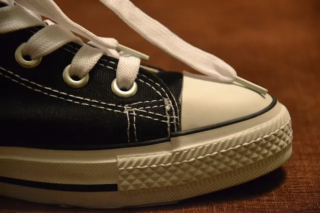 A black and white Shoe with laces