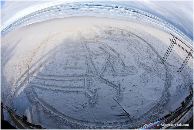 logo recona w piasku