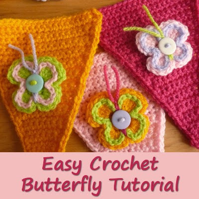 Colored crocheted butterfly motifs with button and yarn detail