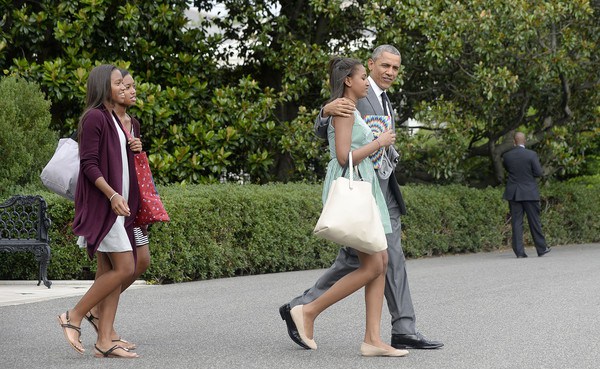 Dad and Sasha Obama with her friends