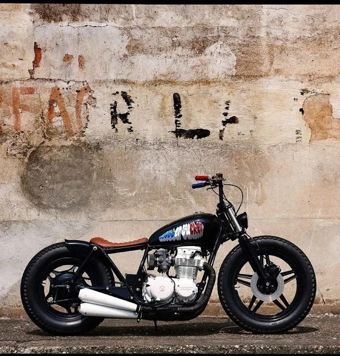 Simple, lovely Honda Brat/Bobber. Sorry I don't have any details.