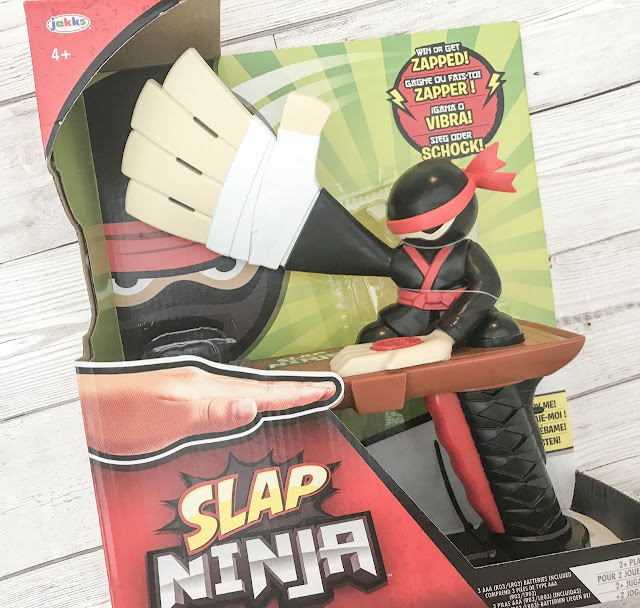 Boxed toy ninja game with a large over sized hand with a chop action