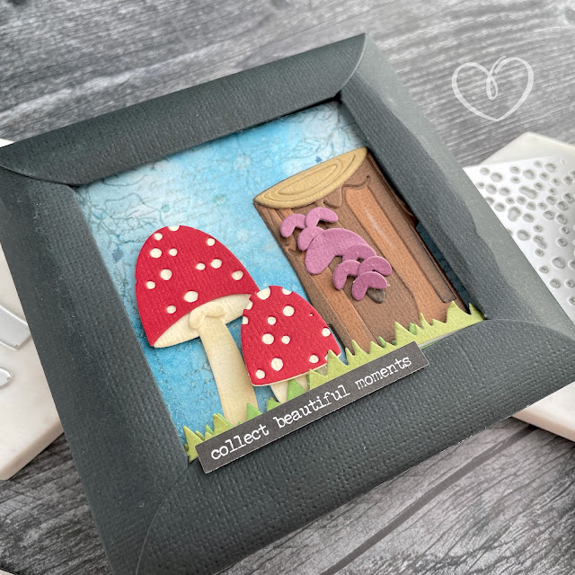 Mushroom and tree stump panel made with cardstock, stamps and die cuts.