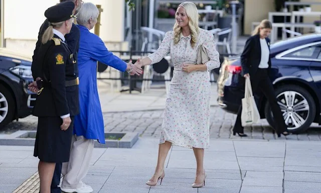 Crown Princess Mette Marit wore a Margot floral print midi dress by Pia Tjelta. Christian Louboutin Pigalle patent beige pumps